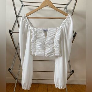 White crop top with sleeves. Never worn!